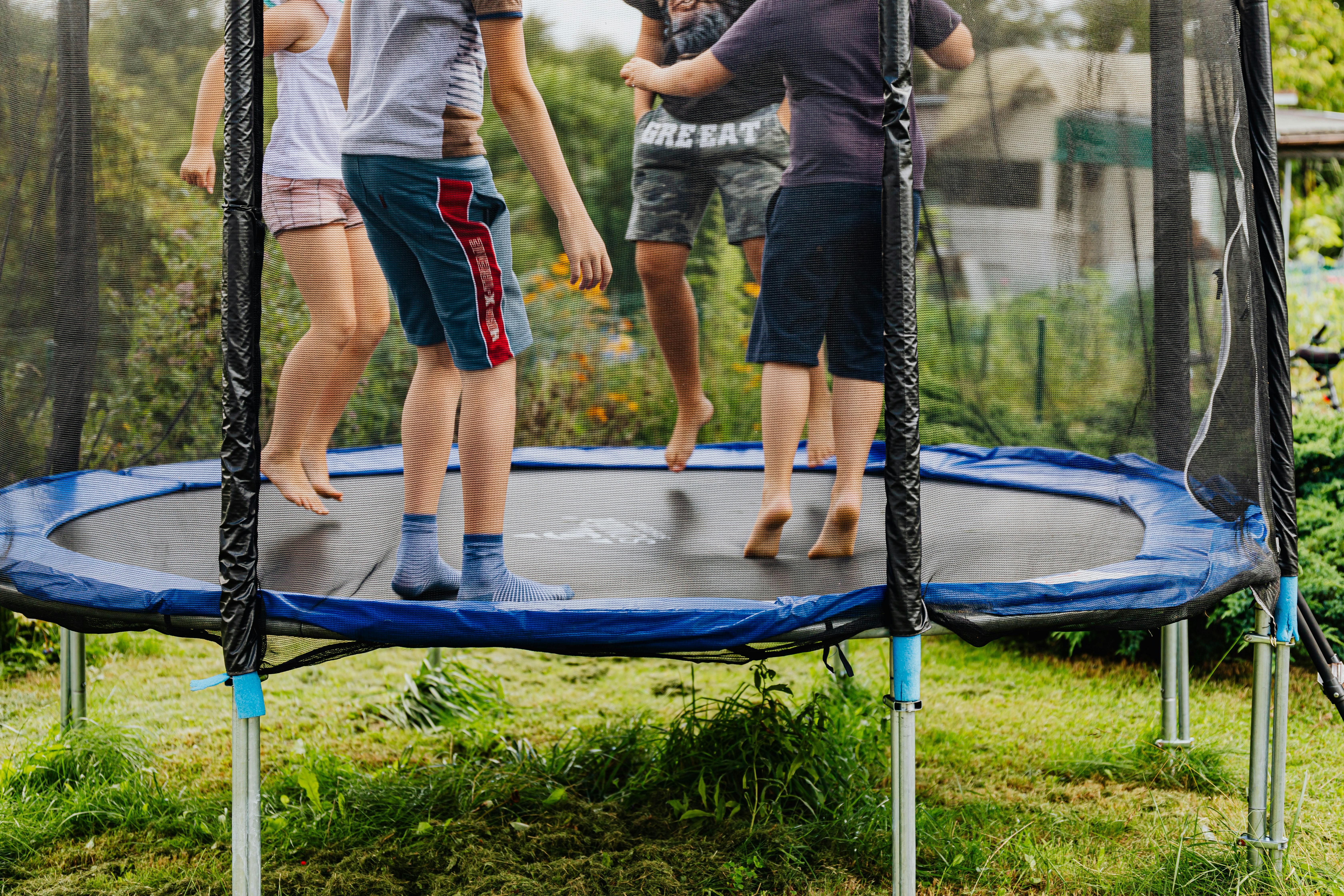 kids jumping on trampoline