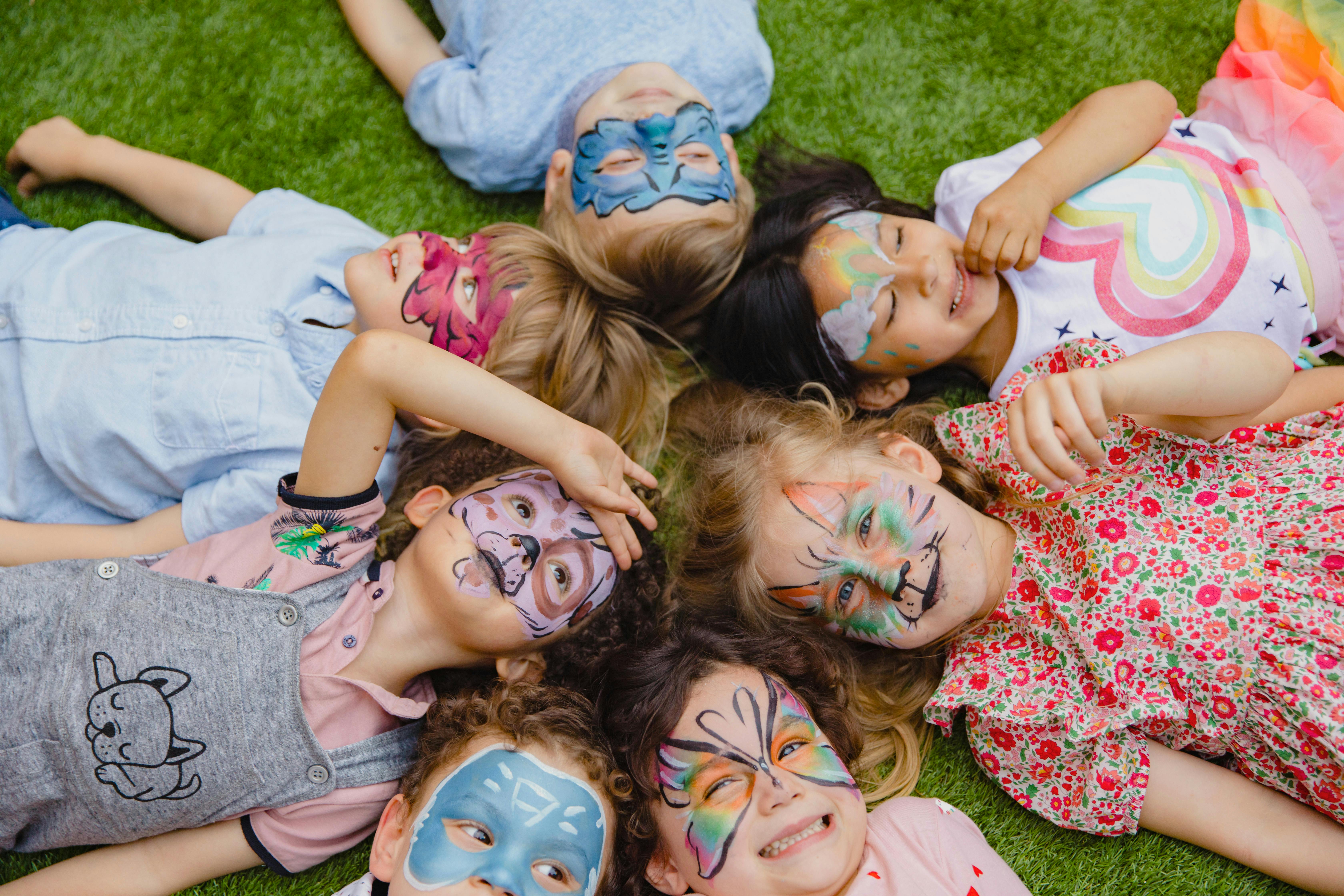 kids at a birthday party with face paint